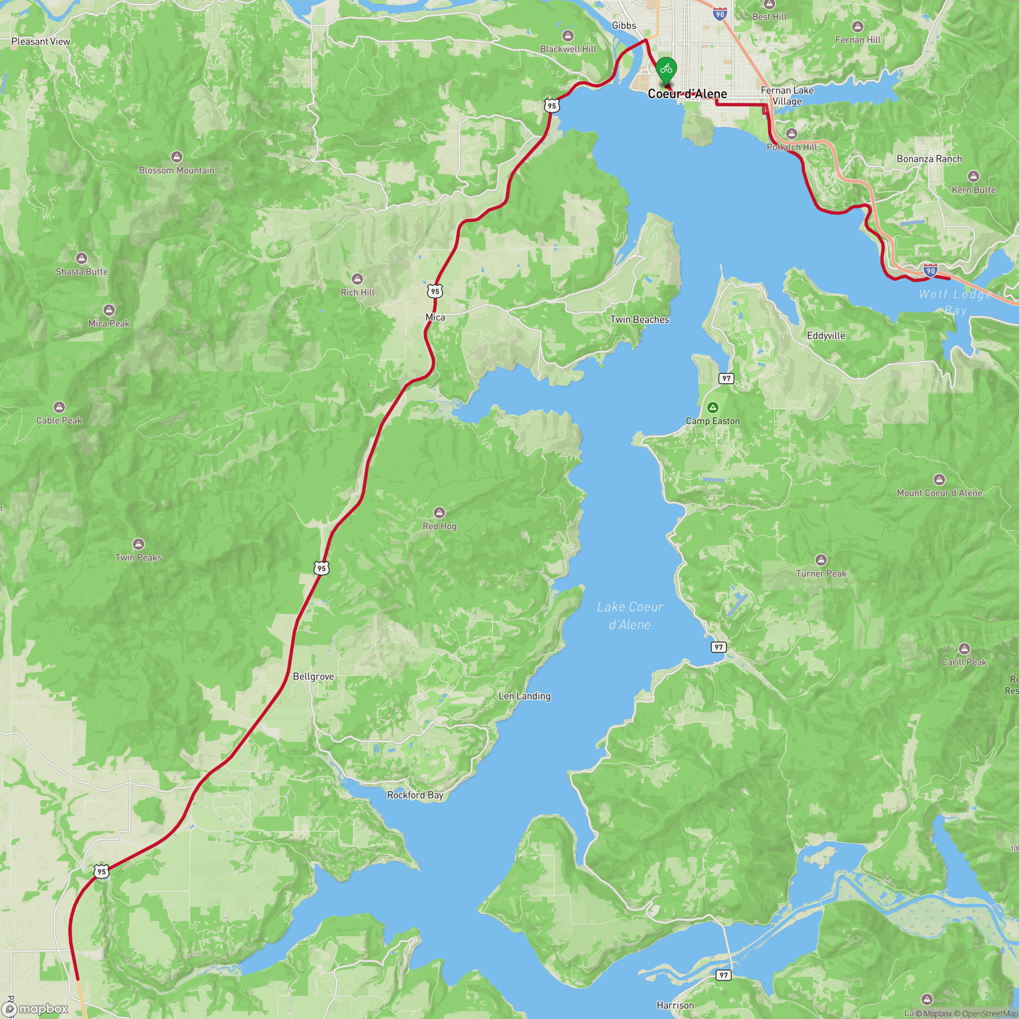 A map showing the route of the bike leg of Ironman 70.3 Coeur d'Alene, running south from Coeur d'Alene along US-95, passing through rural areas along the western shore of Lake Coeur d'Alene.